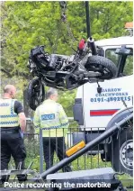  ??  ?? Police recovering the motorbike