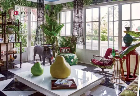 ?? ?? FROM LEFT Tropical prints in the Singapore home of Wendy Smith and Nishan Weerasingh­e; both clad in plaid, Javi Martinez and Tim Yap in their study