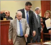  ??  ?? The lawyers in the Jacky Stanley trial return to their seats in Ulster County Court on Wednesday after conferring with Judge Donald A. Williams (background). From left are defense attorneys William Pretsch and Thomas Melanson and Special Assistant...