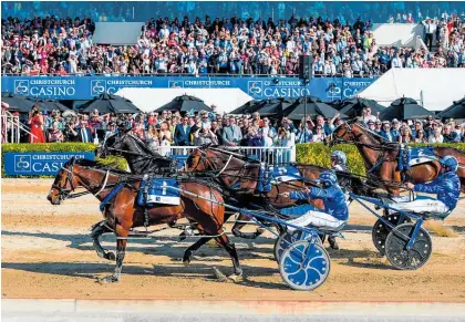  ?? Photo / Photosport ?? Thefixer beats Tiger Tara (far side) in last year’s NZ Cup. Tiger Tara will not be at Addington this year.