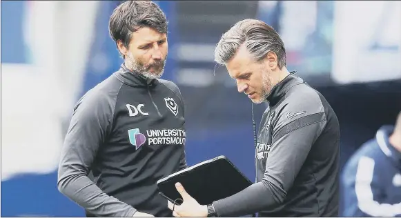  ?? Picture: Joe Pepler ?? CALLING THE SHOTS
Danny, left, and Nicky Cowley will make the decisions over Pompey’s recruitmen­t drive this summer