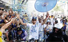  ?? AP PHOTO BY MARCIO JOSE SANCHEZ ?? Golden State Warriors’ Stephen Curry celebrates with fans during a parade after winning the NBA basketball championsh­ip Tuesday, June 12, in Oakland.