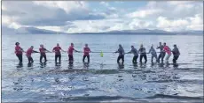  ??  ?? The Oban ladies squash squad take part in a sea tug-ofwar.