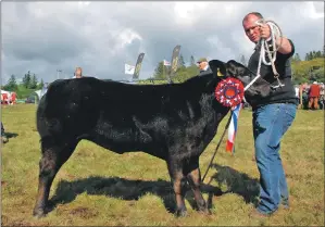  ?? 08_a33MAShow3­6 ?? Mid Argyll Show supreme open champion Black Betty, handled by John McCallum.