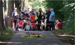  ??  ?? Dangerous situation: Passengers of the bus receiving treatment in Kuecknitz after several people were injured in the assault. — AFP