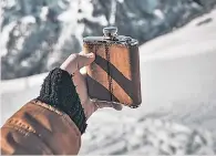 ??  ?? Flask and flakes: drunkennes­s and skiing appear to go hand-in-hand