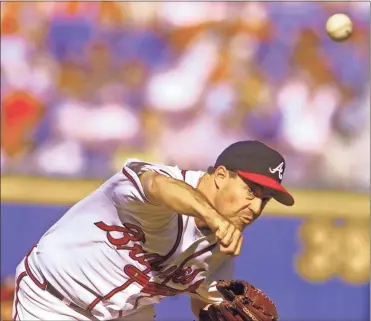  ?? Macon Telegraph/TNS - Nick Oza ?? Braves great and Hall of Famer Greg Maddux has been working in the spring training camp for the Texas Rangers, where his brother, Mike, is pitching coach.