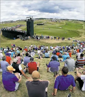  ?? Charlie Riedel/Associated Press ?? USGA executive director Mike Davis was impressed with how well the course at Erin Hills held up despite the rainy weather.