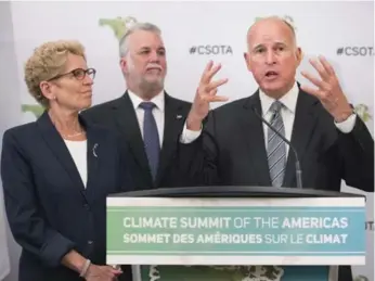  ?? DARREN CALABRESE/THE CANADIAN PRESS ?? California Gov. Jerry Brown, right, speaks to reporters with Ontario Premier Kathleen Wynne and Quebec Premier Philippe Couillard at the Climate Summit of the Americas on Wednesday.