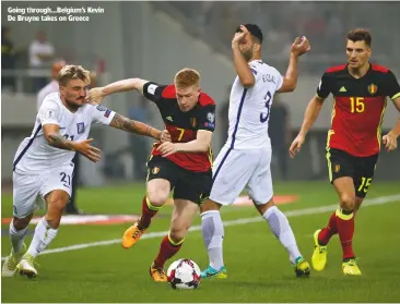  ??  ?? Going through...Belgium’s Kevin De Bruyne takes on Greece