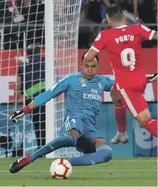  ?? Reuters ?? Real Madrid goalkeeper Keylor Navas races off his line to deny Girona’s Portu a chance to score on Sunday evening