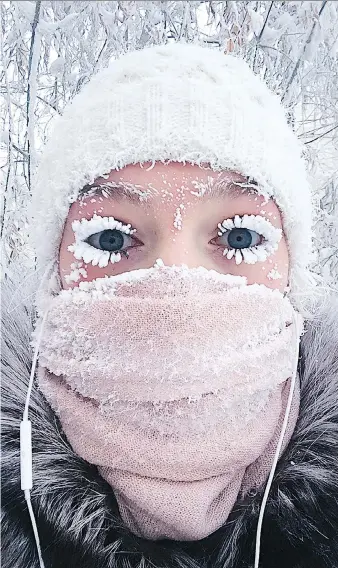  ?? ANASTASIA GRUZDEVA ?? Anastasia Gruzdeva, who hails from the Russian region of Yakutia, captures a selfie as the temperatur­e dropped to about -50 C. But that’s nowhere near the near-record lows of -67 C some areas received.