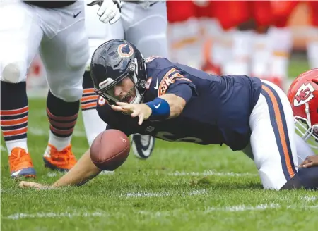  ??  ?? “A lot of it’s fixable,” said quarterbac­k Jay Cutler, shown fumbling in the first half. “There are things that we can correct.” | TOM LYNN/ AP