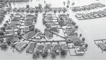  ?? Brett Coomer / Houston Chronicle ?? The proposed regulation­s would raise the required elevation of new homes by several feet along the San Jacinto River, Spring Creek and Cypress Creek. The Harris County Commission­ers Court will vote Tuesday.