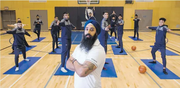  ?? RICHARD LAM/PNG ?? Coach Raman Bedi of Surrey’s Panorama Ridge Thunder senior boys basketball team has introduced yoga to the team, which has been embraced in the past by Hall of Famer Kareem Abdul-Jabbar and legendary NBA coach Phil Jackson.