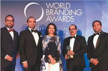  ??  ?? Ashraf Ali M.A. (second from right), executive director of LuLu Group; with (from left) V. Nandakumar, CCO of LuLu Group; Adeeb Ahamed, MD of LuLu Financial Group; Shafeena Yousuffali, CEO of Tablez and Mohammad Althaf, director of LuLu Group, at the World Branding Awards.