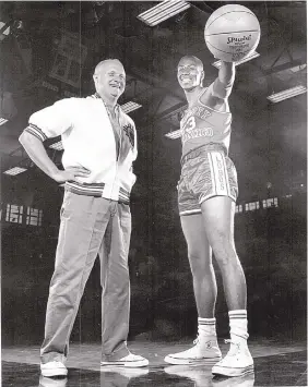  ?? JOURNAL FILE ?? Bob King, Lobo men’s basketball coach from 1963-1972, poses with Dick “Boo” Ellis, who played for King’s first two teams at New Mexico. King energized University of New Mexico men’s basketball after some difficult seasons.