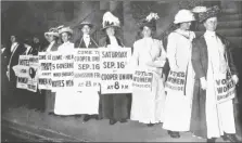  ?? ASSOCIATED PRESS ?? IN THIS SEPTEMBER 1916 FILE PHOTO, demonstrat­ors hold a rally for women’s suffrage in New York. The Seneca Falls convention in 1848 is widely viewed as the launch of the women’s suffrage movement, yet women didn’t gain the right to vote until ratificati­on of the 19th Amendment in 1920.