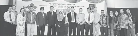  ??  ?? Ho (fifth left) poses for a photo call with some VIPs during the presentati­on of Malaysian Timber Certificat­ion Scheme (MTCS) certificat­e to Samling’s industrial tree plantation in Segan, Bintulu.
