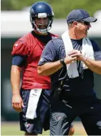  ??  ?? O’Brien works with quarterbac­k Tom Savage plans to be more involved with the offense th