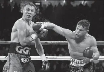  ?? AP PHOTO ?? Saul “Canelo” Alvarez (right) and Gennady Golovkin fought to a draw last year. Their rematch is set for May 5.