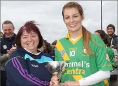  ??  ?? Louise Hammel receives the cup from Kathleen Kehoe (Secretary).