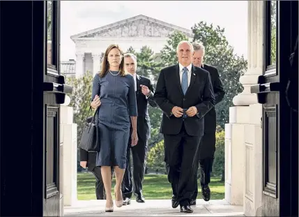  ?? Erin Schaff / New York Times ?? Amy Coney Barrett, President Donald Trump's nominee to the Supreme Court, and Vice President Mike Pence enter the Capitol in Washington on Sept. 29.