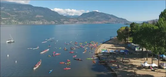  ?? TIM FEENY/Limelight Studios ?? Paddlers gather off Hot Sands Beach in City Park for the opening of the Kelowna Paddle Trail last weekend.