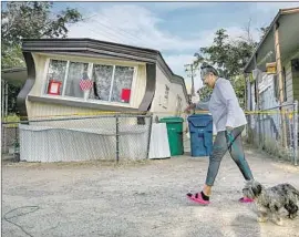  ?? Irfan Khan Los Angeles Times By Rong-Gong Lin II ?? CARMEN RIVERA walks in Ridgecrest, Calif., a day after the first earthquake. It is plausible that a car fell on a man from the shaking felt in Pahrump, Nev.