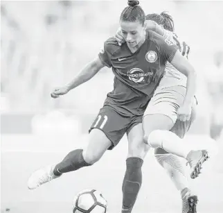 ?? JEREMY REPER/ISI PHOTOS ?? Defender Ali Krieger’s versatilit­y helped the Pride earn a 2-1 victory over the Red Stars on Wednesday night. Krieger, center, played out of position during the victory.