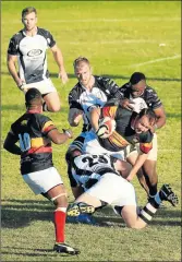  ?? Picture: SINO MAJANGAZA ?? OUTNUMBERE­D: Buffs player Tjaart Venter is tackled during the club match against Old Boys at Mike Pendock Motors Park on Saturday afternoon