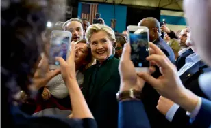  ?? — AFP ?? US Democratic presidenti­al nominee Hillary Clinton greets supporters during a campaign rally at Cuyahoga Community College in Cleveland, Ohio.