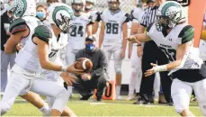  ??  ?? Pennridge’s Bobby Croyle hands off to Dillon Powles during Thursday’s game against Quakertown at Alumni Field in Quakertown.