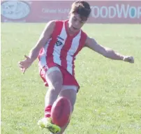  ??  ?? Blake Zimora boots the ball into attack during the under 16 match against Newborough.