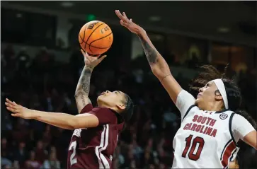  ?? NELL REDMOND — THE ASSOCIATED PRESS ?? South Carolina center Kamilla Cardoso looks to block a shot by Mississipp­i State guard JerKaila Jordan in Columbia, S.C., on Jan. 7.