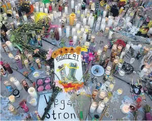  ?? Pictures: Getty Images. ?? A makeshift memorial to the victims of the gunman, Stephen Paddock, who President Trump described as “demented”.