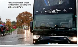  ?? ?? Fans and children cheer the team bus as it departs St George’s Park