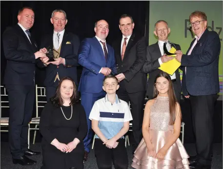  ??  ?? At the presentati­on of trophies to the connection­s of Redzer Ardfert, Stayer of the Year at the IGB’s National Greyhound Racing Awards last week Wayne McCarthy, IGB Board, presents the winner’s trophy to Brendan Maunsell, while Ger Dollard, CEO IGB, presents the breeders trophy to Adrian Clifford, and Frank Nyhan, IGB Chairman, presents the owner’s trophy to joint-owner Pat Reddan. Also pictured are Brendan Maunsell, jnr, and Sarah Maunsell.