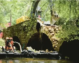  ?? MONICA CABRERA/THE MORNING CALL ?? Contractor Grace Industries start demolition on the 102-foot, county-owned Meadows Road Bridge on Tuesday outside of Hellertown in Northampto­n County. The demolition is expected to take two weeks if there are no weather delays.