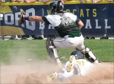  ?? MATTHEW B. MOWERY PHOTOS — MEDIANEWS GROUP ?? Clarkston’s Preston Stout slides into home ahead of the throw to Waterford Kettering catcher Logan Van Sicklen during the third inning of Tuesday’s Division 1predistri­ct game at Oxford. Clarkston went on to win, 9-4, and faces host Oxford in Saturday’s district semifinals.