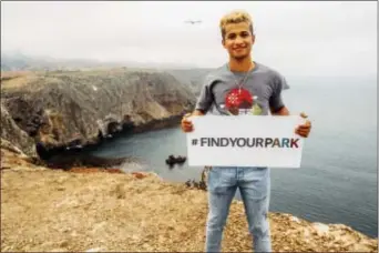  ?? DONNA IRENE MUCCIO/NATIONAL PARK FOUNDATION VIA AP ?? This July 18 photo shows actor Jordan Fisher at Channel Islands National Park in California as an ambassador for the National Park Service. The National Park Service is marking its 101st birthday amid a “Parks 101” campaign enlisting celebritie­s,...
