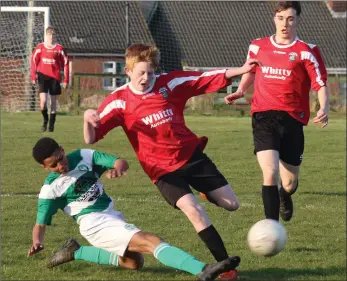  ??  ?? Maxwell Shoyegin (Shamrock Rovers) takes the ball away from Ciarán Horan (St. Leonards) in their Under-15 Cup semi-final encounter in Enniscorth­y last week.