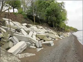  ?? DAVID S. GLASIER — THE NEWS-HERALD ?? Pre-cast concrete barriers installed as erosion barriers on a Timberlake lakefront property.