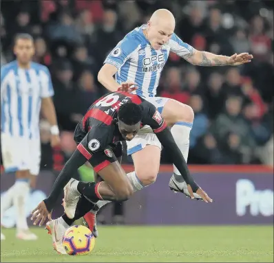  ?? PICTURE: ADAM DAVY/PA ?? EDGED OUT: Bournemout­h’s Jefferson Lerma and Huddersfie­ld Town’s Aaron Mooy, right, battle for the ball at Dean Court.