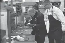  ?? NICK OXFORD / THE NEW YORK TIMES ?? Scott Uehlein, left, tests a new creation as Justin Morrow looks on in the culinary innovation center at Sonic corporate headquarte­rs in Oklahoma City. J. Clifford Hudson, chief executive at Sonic Drive-in, is a Democrat who values diversity but...