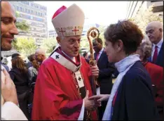  ??  ?? This Oct. 1, 2017, file photo shows Cardinal Donald Wuerl, Archbishop of Washington shaking hands with churchgoer­s at St. Mathews Cathedral after the Red Mass in Washington. Wuerl is defending himself ahead of a forthcomin­g grand jury report investigat­ing child sexual abuse in six of Pennsylvan­ia’s Roman Catholic dioceses. He says the report will be critical of some of his actions as Pittsburgh’s bishop. AP PHOTO/JOSE LUIS MAGANA