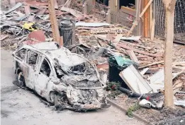  ?? MARK HUMPHREY/AP ?? A vehicle destroyed after a bomb exploded on Christmas Day sits on a street Tuesday in Nashville, Tennessee. The bomber died in the blast.