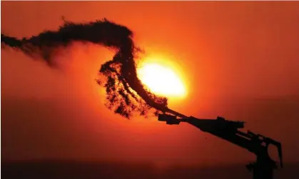  ?? ?? A field of potatoes being irrigated at sunset as a heatwave hits Europe, in Aubencheul-au-Bac, France. Photograph: Pascal Rossignol/ Reuters