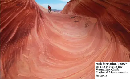  ??  ?? rock formation known as The Wave in the Vermilion Cliffs National Monument in Arizona