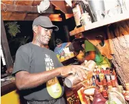  ?? PHOTOS BY GLADSTONE TAYLOR/PHOTOGRAPH­ER ?? Mixologist Anthony Wilson mixing up something tasty and strong.